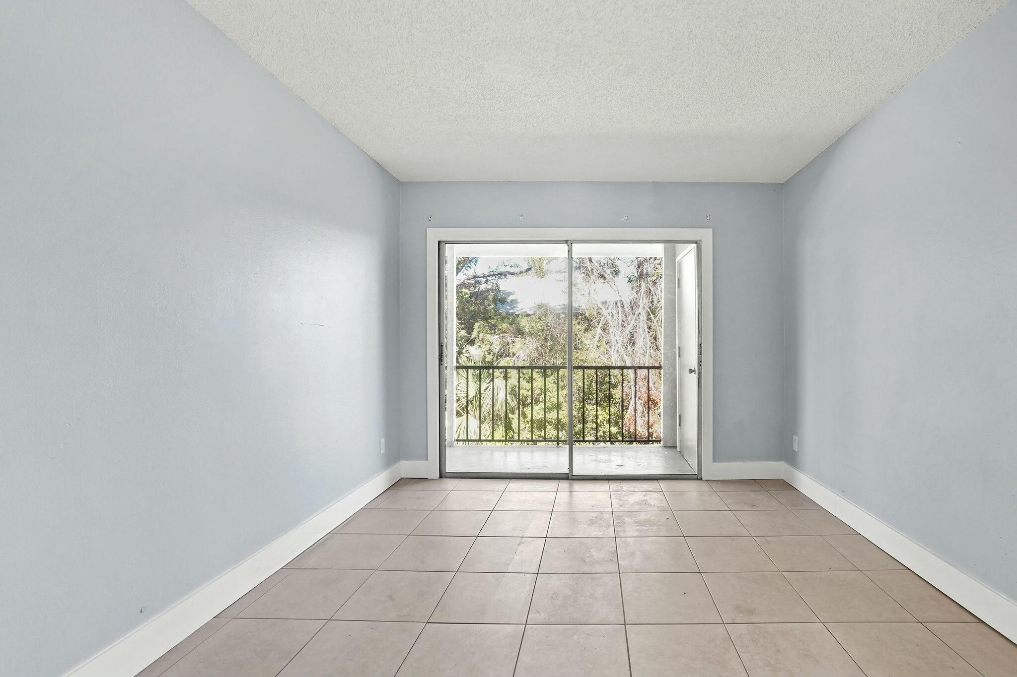 983 Northwest Spruce Ridge Drive, Unit 4 Stuart, FL 34994 - Photo 24 of 56 a view of an empty room with a window