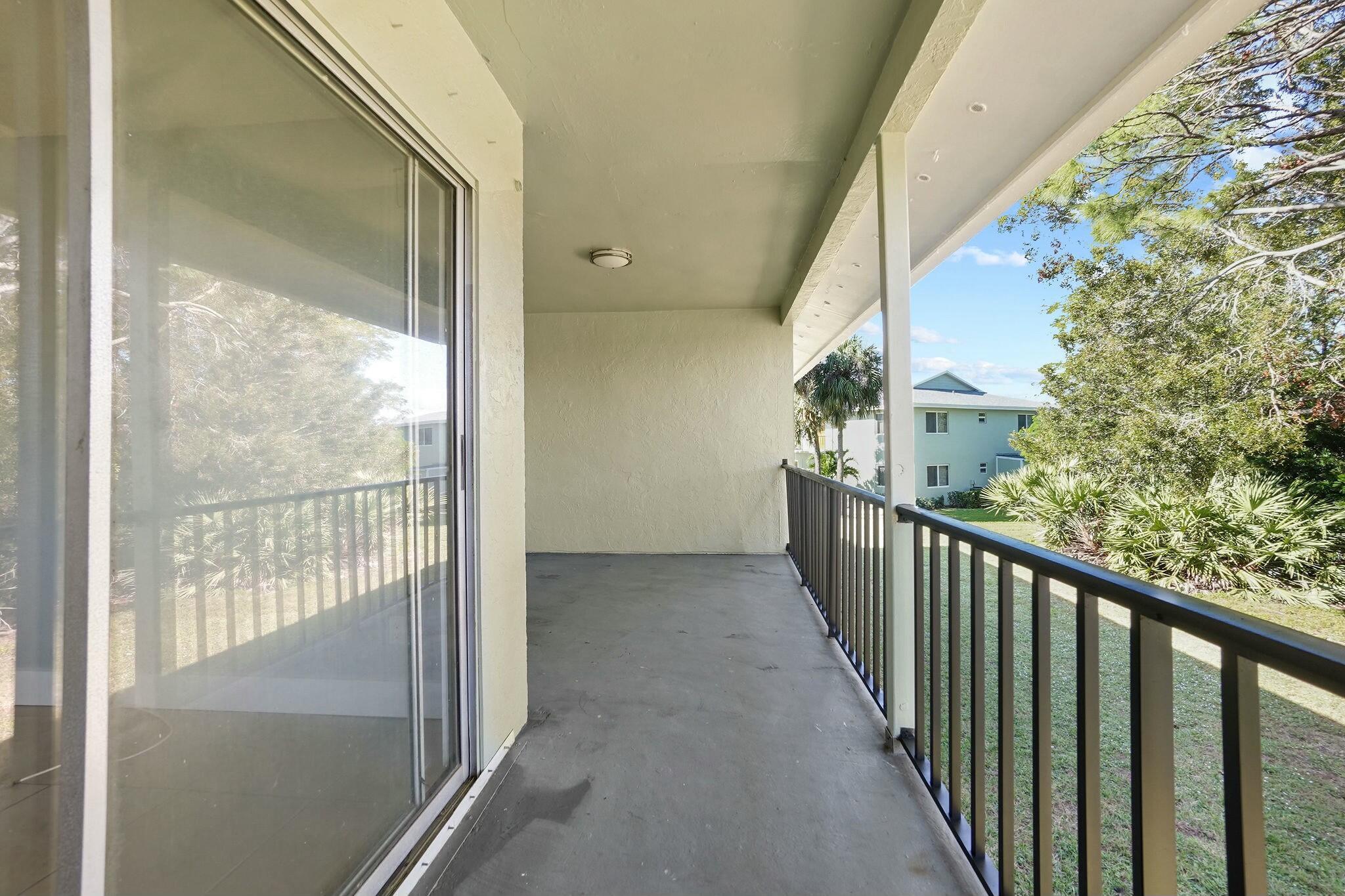 983 Northwest Spruce Ridge Drive, Unit 4 Stuart, FL 34994 - Photo 27 of 56 a view of a balcony