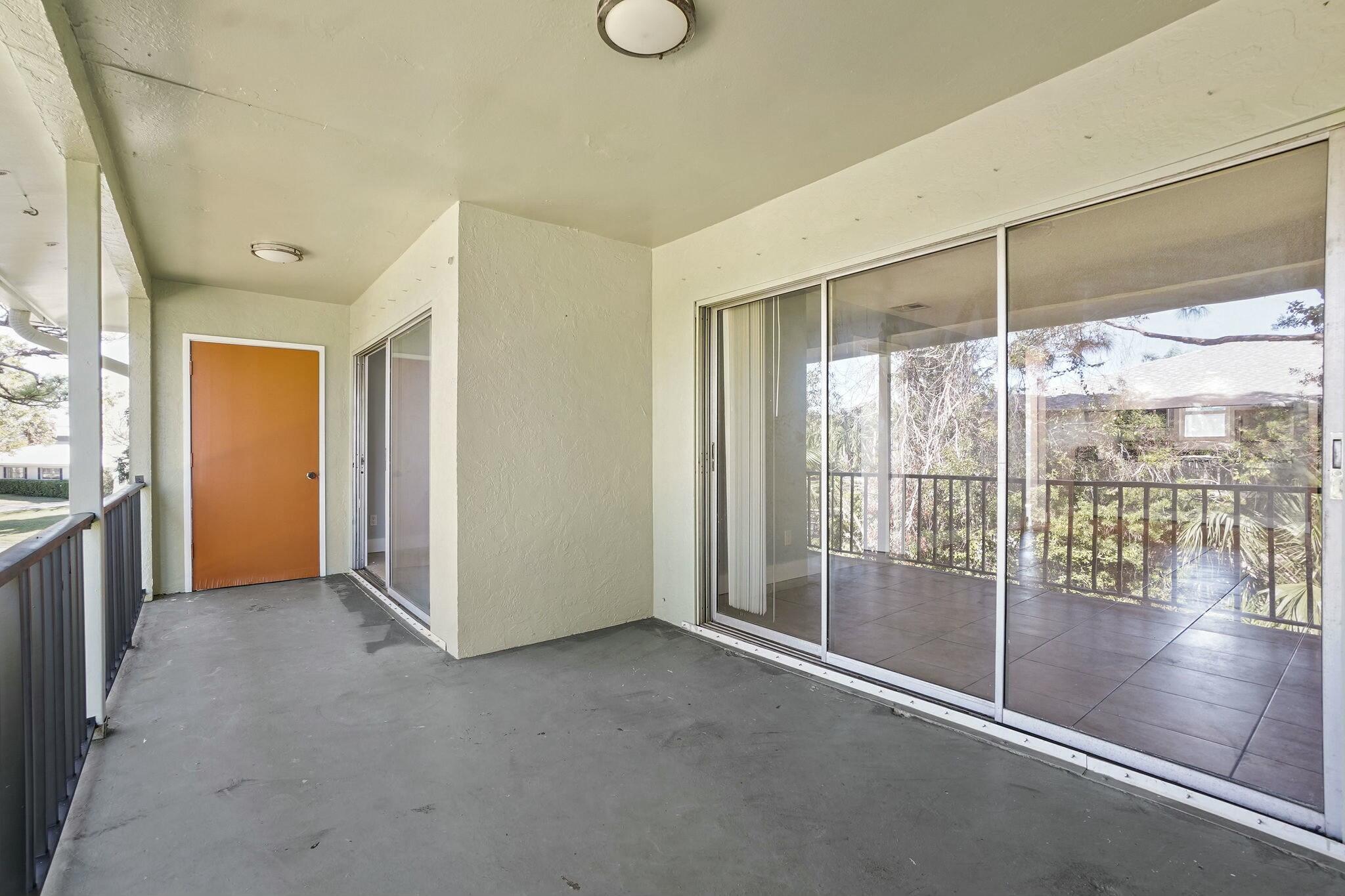 983 Northwest Spruce Ridge Drive, Unit 4 Stuart, FL 34994 - Photo 29 of 56 a view of empty room with floor to ceiling window