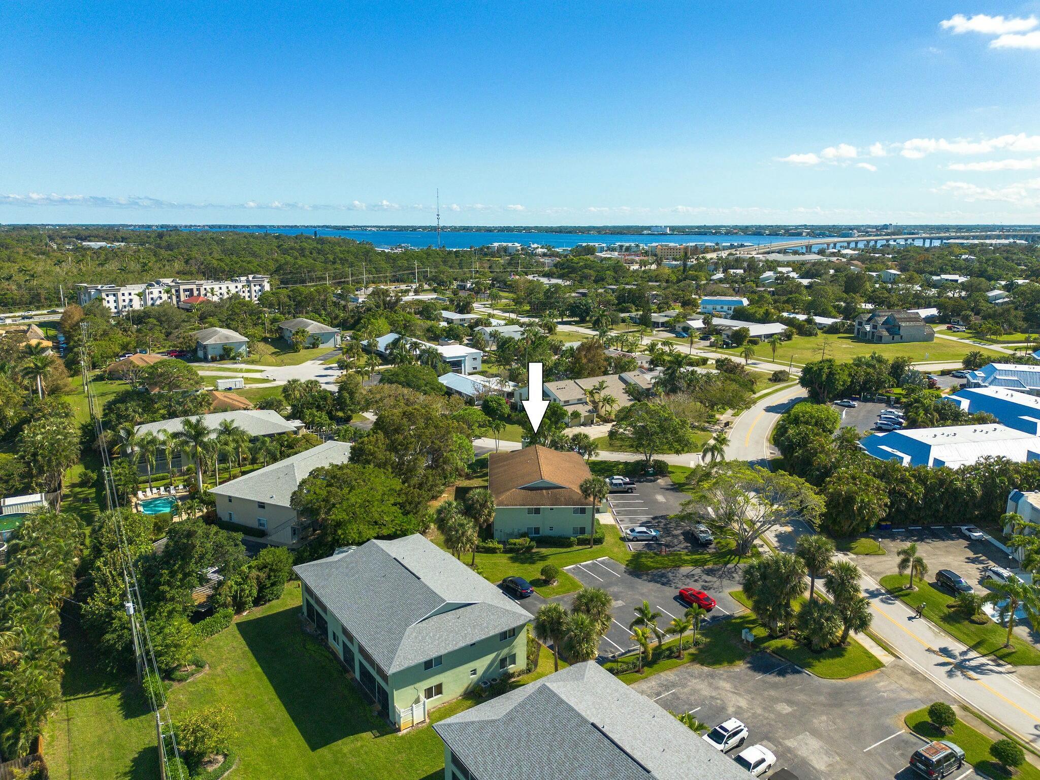 983 Northwest Spruce Ridge Drive, Unit 4 Stuart, FL 34994 - Photo 55 of 56 an aerial view of residential houses with outdoor space