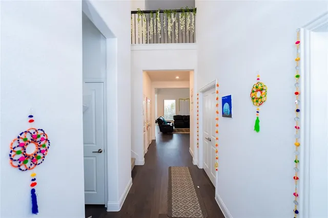 a hallway with toys and wooden floor