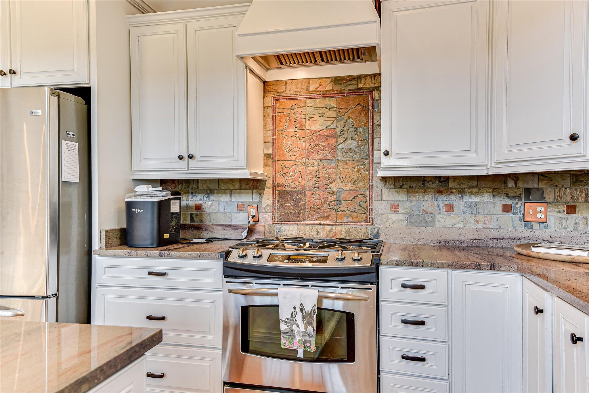 1063 Colbert Bridge Road Aiken, SC 29803 - Photo 10 of 68 a kitchen with stainless steel appliances granite countertop a stove a sink and a refrigerator