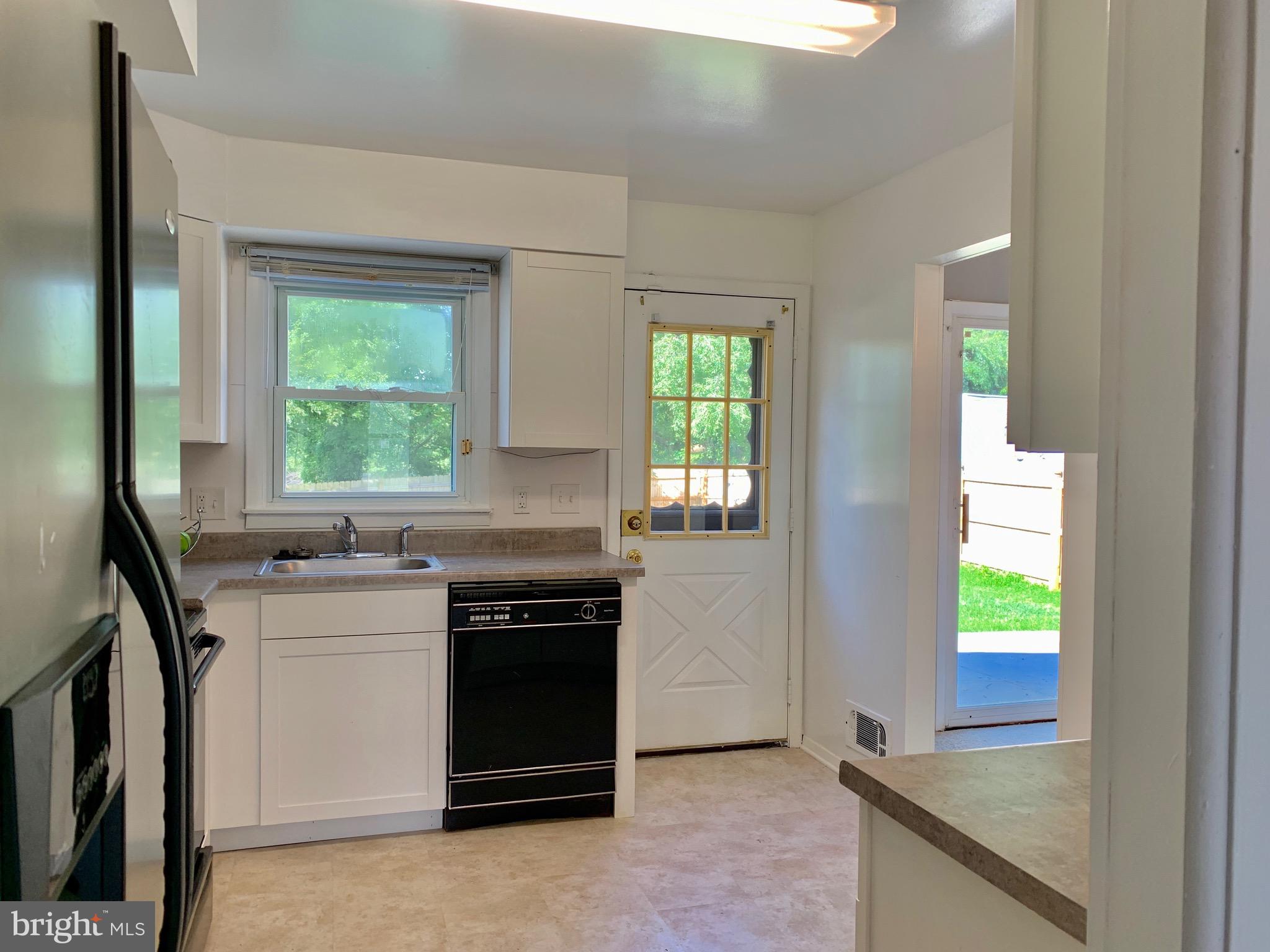 8508 Stevenswood Road Baltimore, MD 21244 - Photo 11 of 45 a kitchen with a stove and a sink