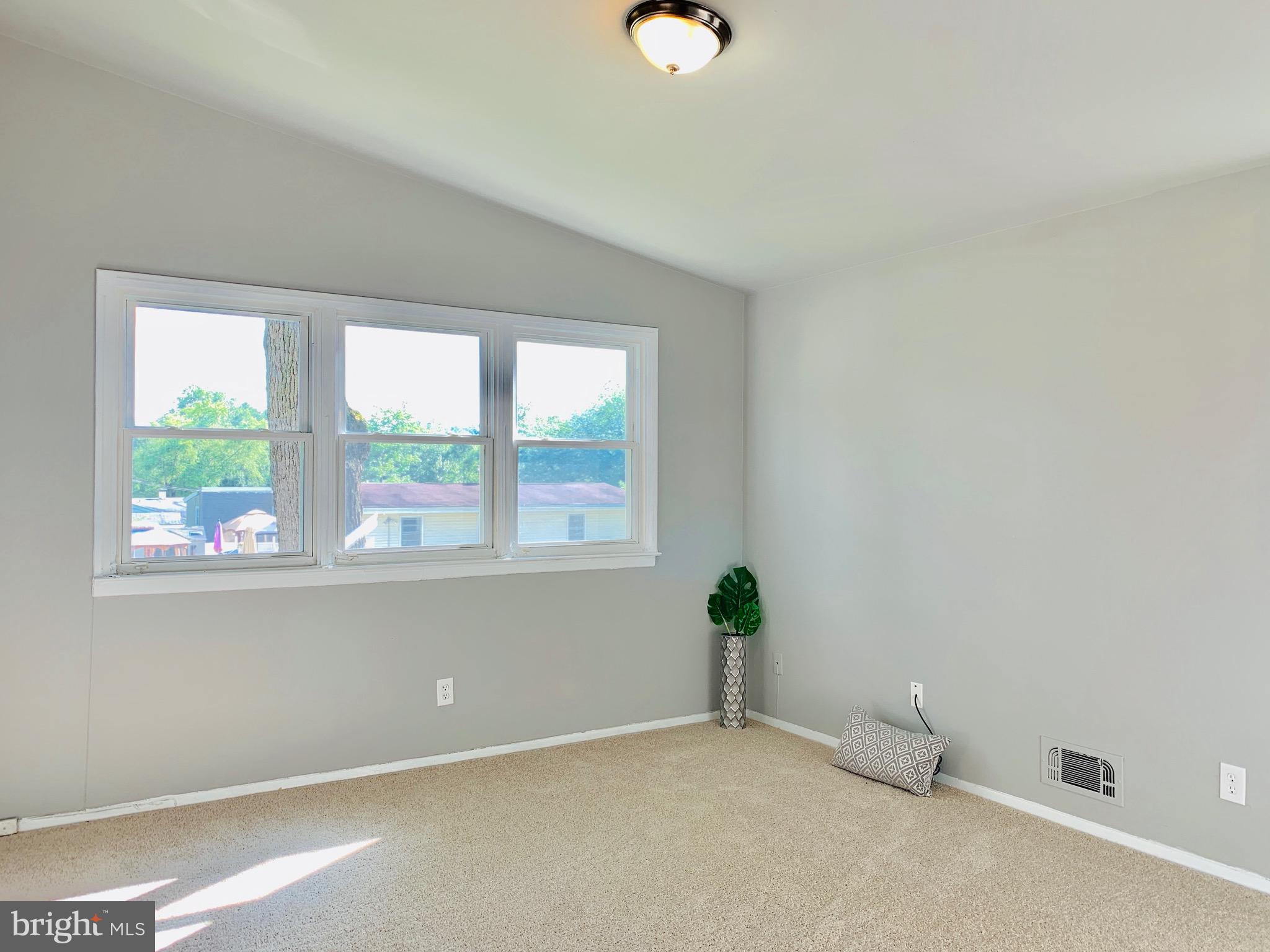 8508 Stevenswood Road Baltimore, MD 21244 - Photo 12 of 45 an empty room with windows