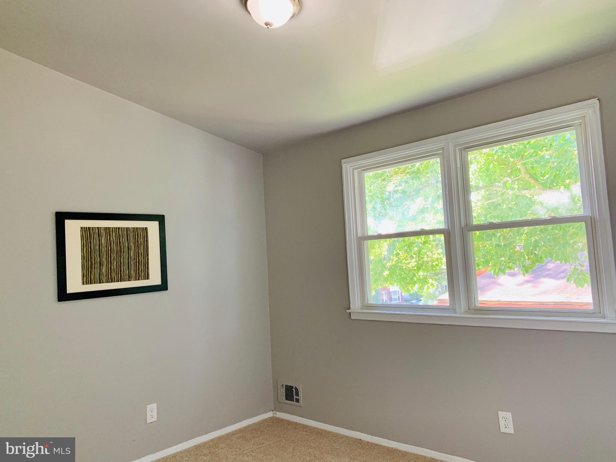 8508 Stevenswood Road Baltimore, MD 21244 - Photo 22 of 45 a view of an empty room with a window