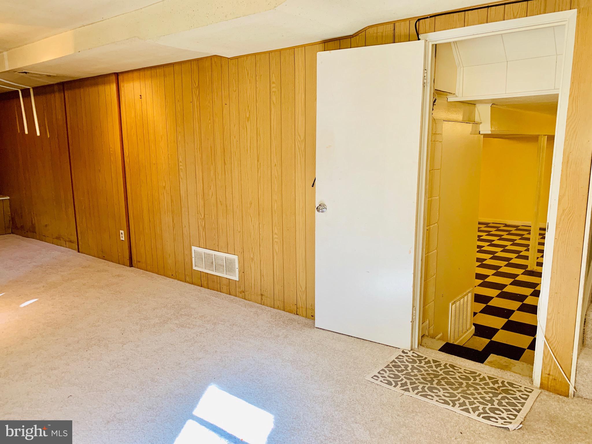 8508 Stevenswood Road Baltimore, MD 21244 - Photo 30 of 45 a view of a room with a door and wooden floor