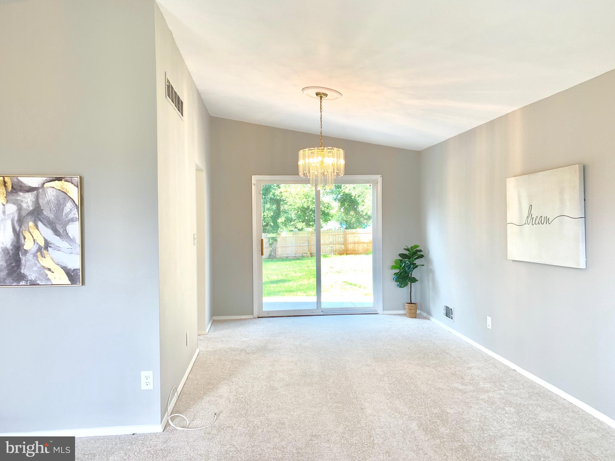 8508 Stevenswood Road Baltimore, MD 21244 - Photo 4 of 45 a view of a room with a windows and chandelier