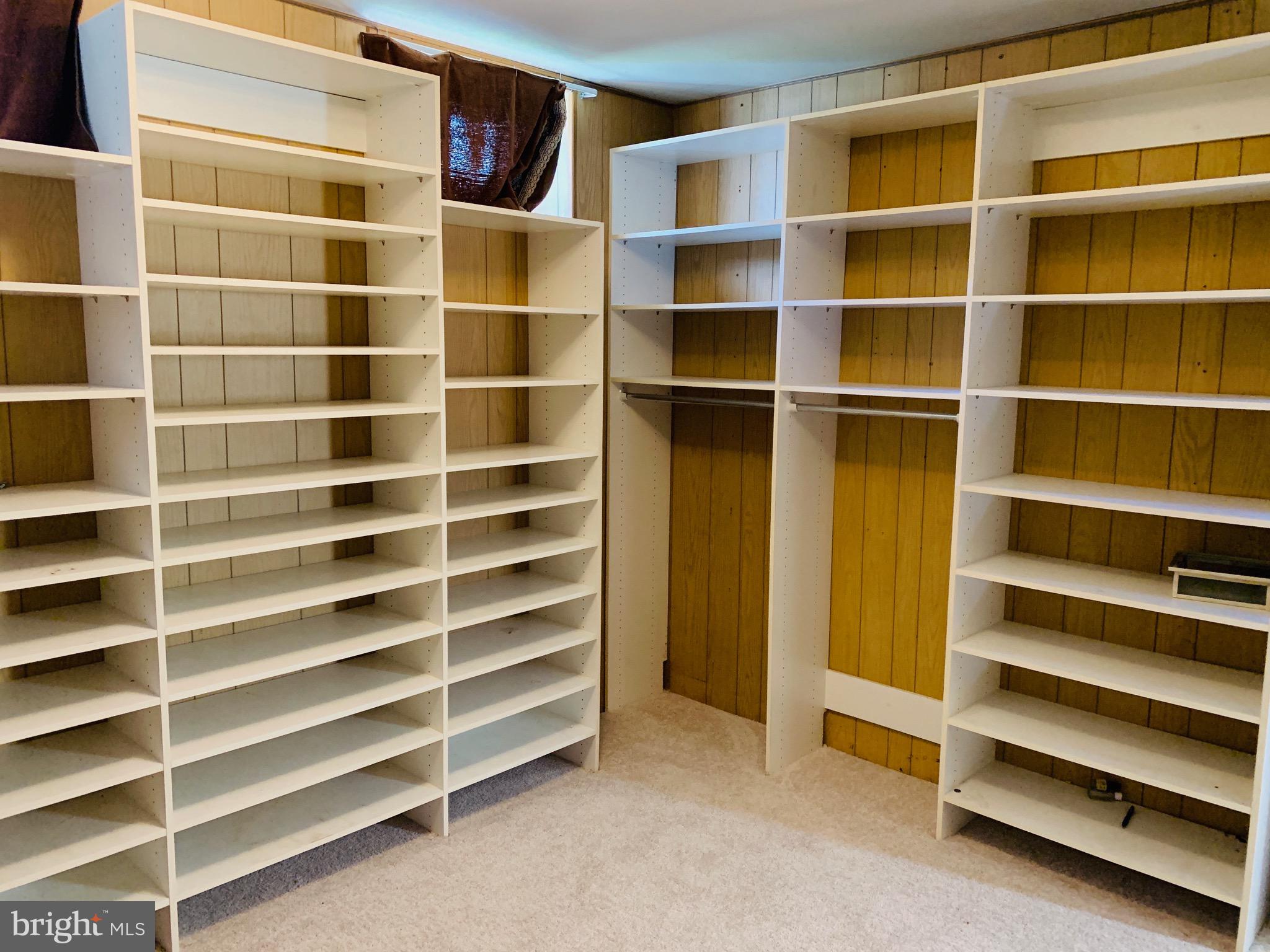 8508 Stevenswood Road Baltimore, MD 21244 - Photo 33 of 45 a view of walk in closet with empty racks