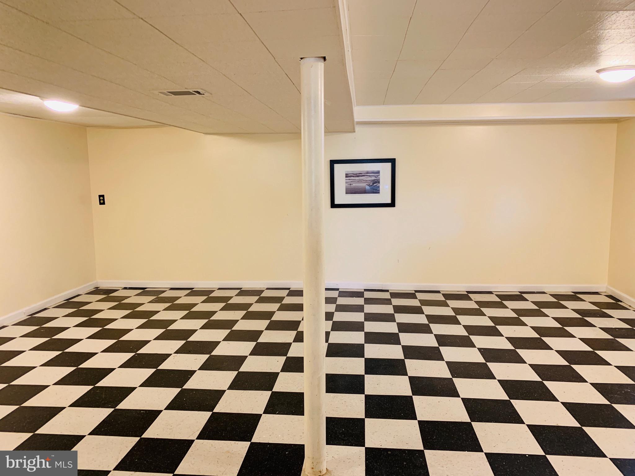 8508 Stevenswood Road Baltimore, MD 21244 - Photo 37 of 45 a black and white checkered floor