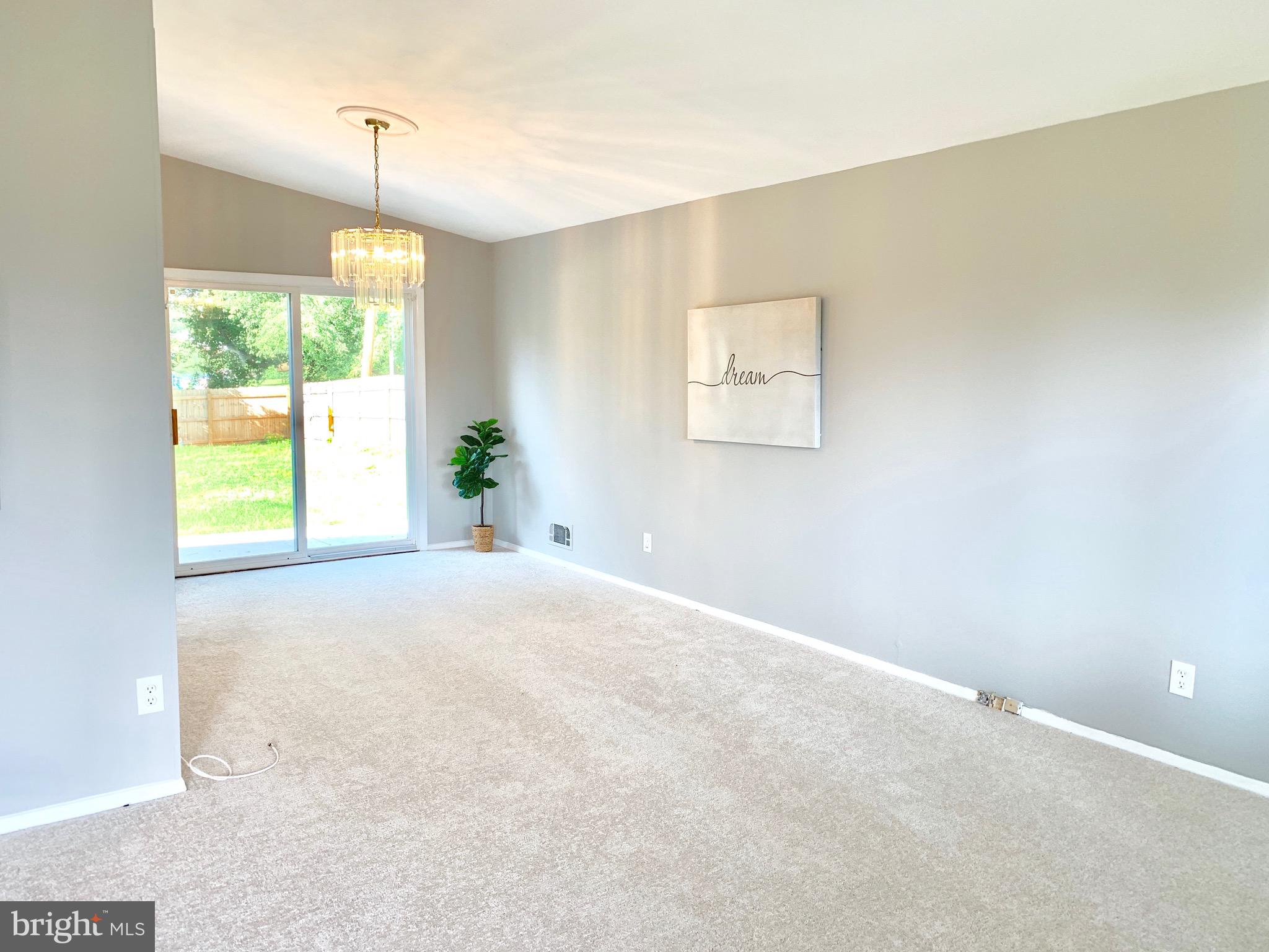 8508 Stevenswood Road Baltimore, MD 21244 - Photo 6 of 45 a view of an empty room with a window