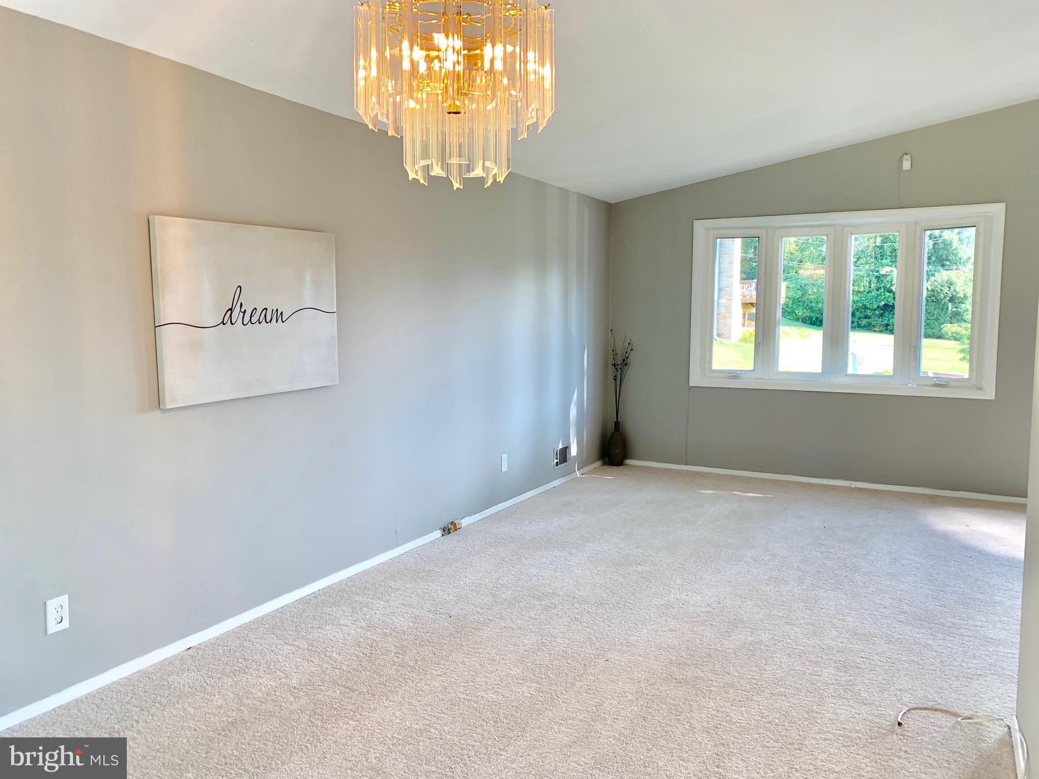 8508 Stevenswood Road Baltimore, MD 21244 - Photo 7 of 45 a view of an empty room with a window