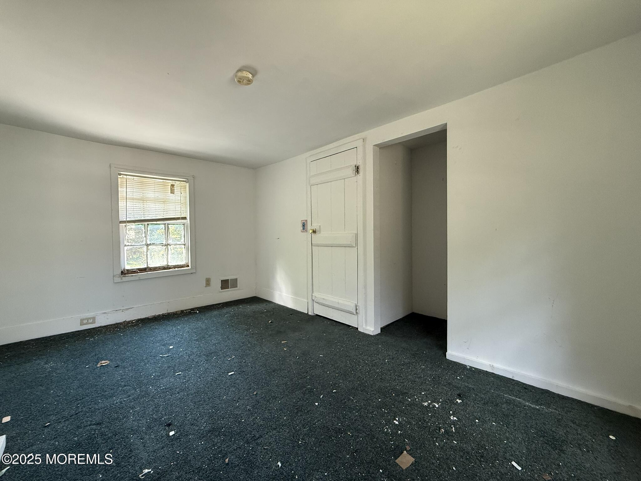 225 Jones Road, Unit 104 Barnegat, NJ 08005 - Photo 16 of 44 an empty room with windows