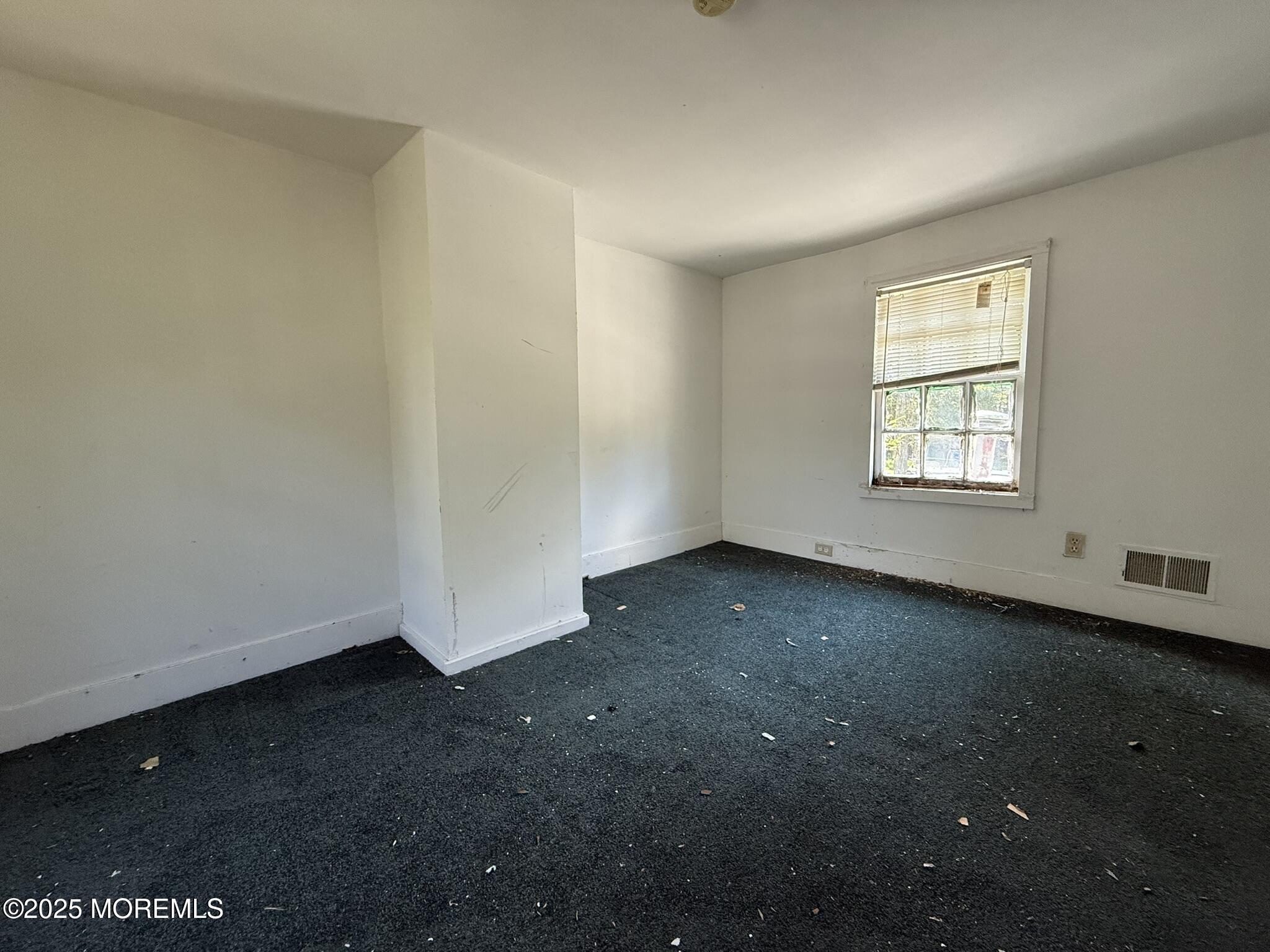 225 Jones Road, Unit 104 Barnegat, NJ 08005 - Photo 17 of 44 an empty room with a window