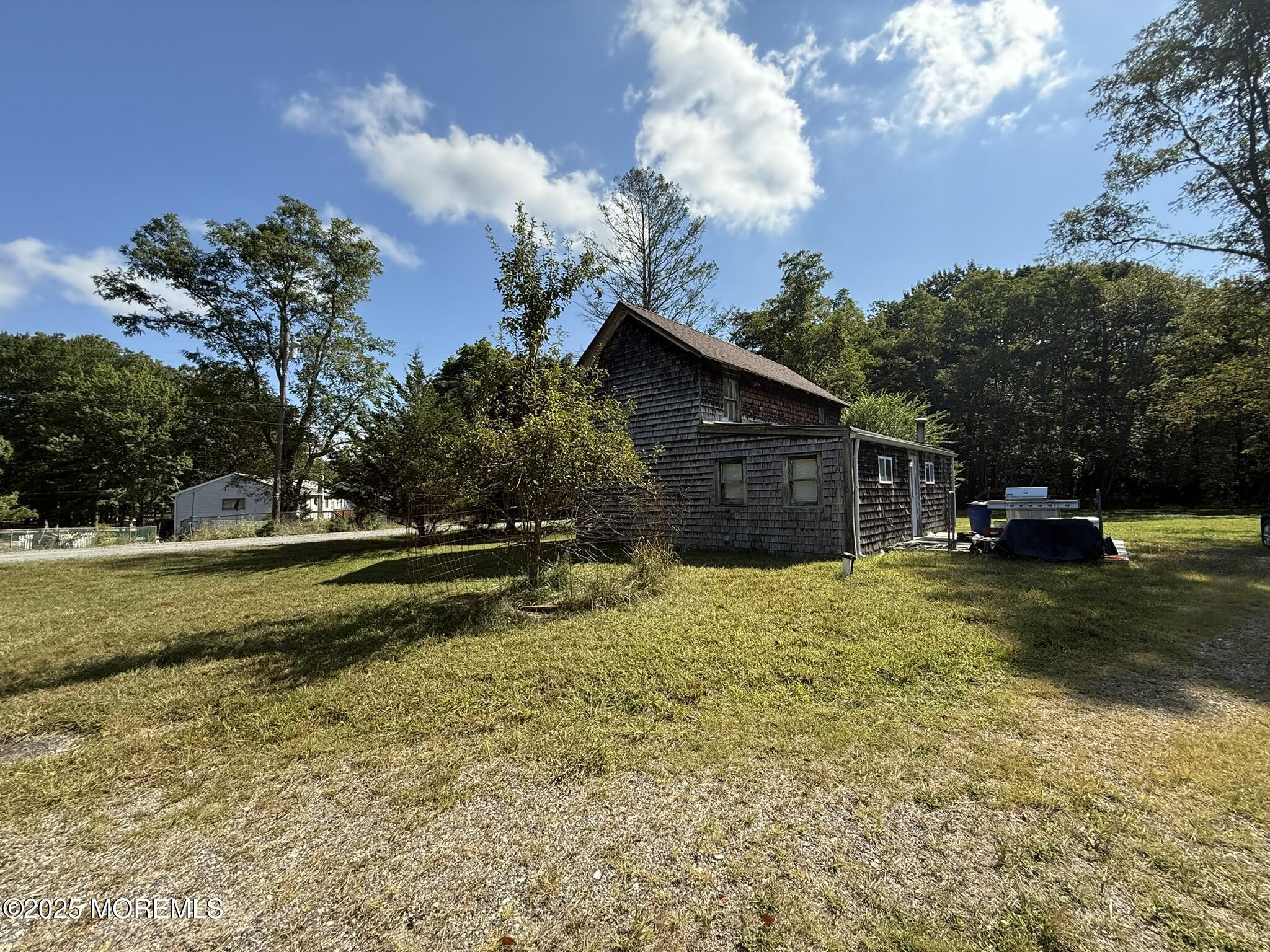 225 Jones Road, Unit 104 Barnegat, NJ 08005 - Photo 19 of 44 a view of a house with a yard