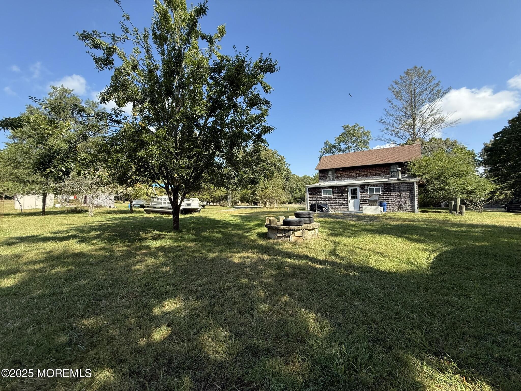 225 Jones Road, Unit 104 Barnegat, NJ 08005 - Photo 31 of 44 a view of a house with a big yard