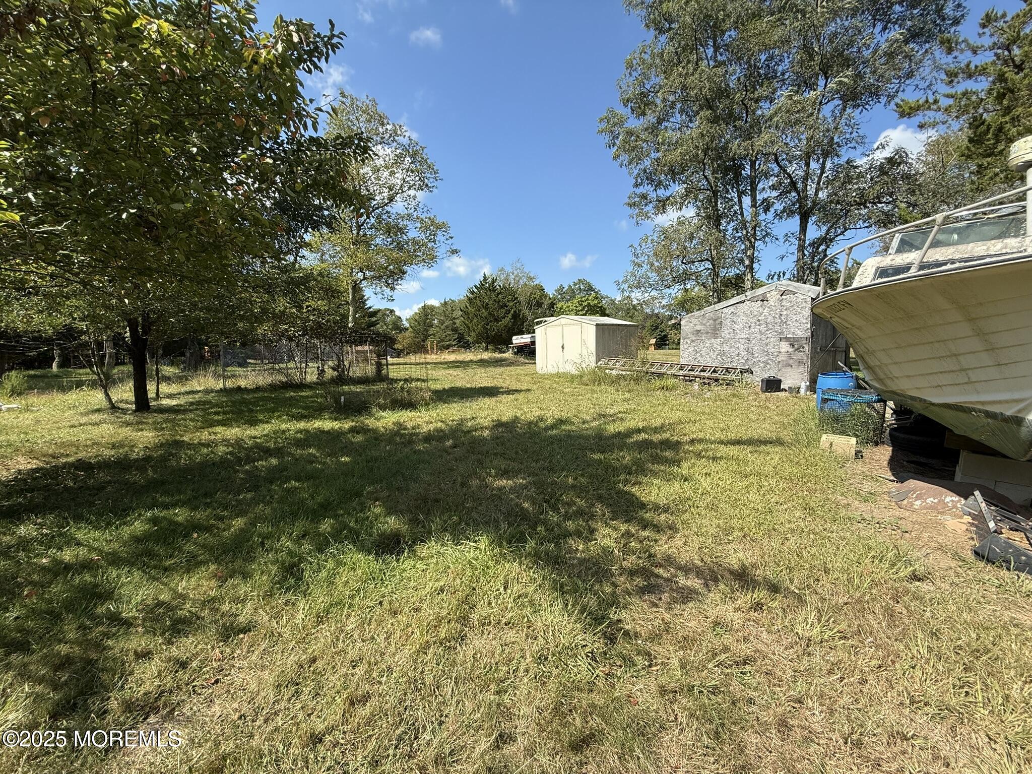 225 Jones Road, Unit 104 Barnegat, NJ 08005 - Photo 35 of 44 a view of a big yard with an trees