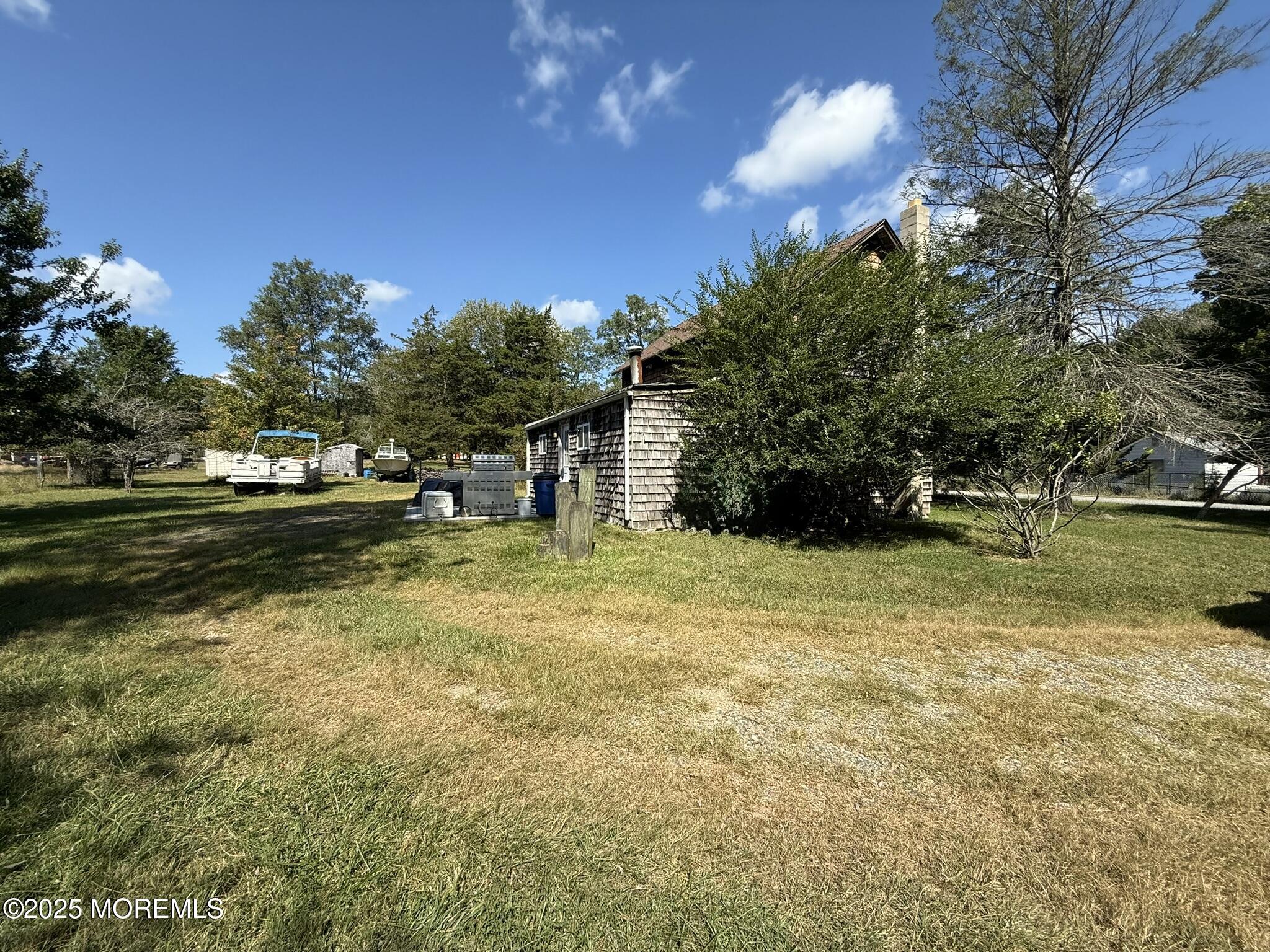 225 Jones Road, Unit 104 Barnegat, NJ 08005 - Photo 37 of 44 a view of a house with a yard