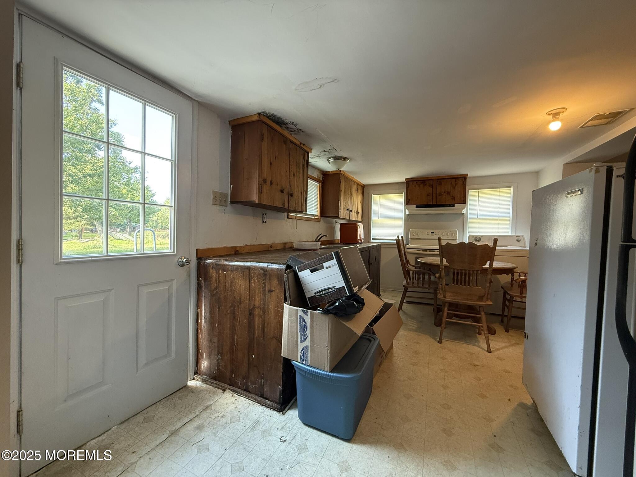 225 Jones Road, Unit 104 Barnegat, NJ 08005 - Photo 4 of 44 a work room with furniture and a window