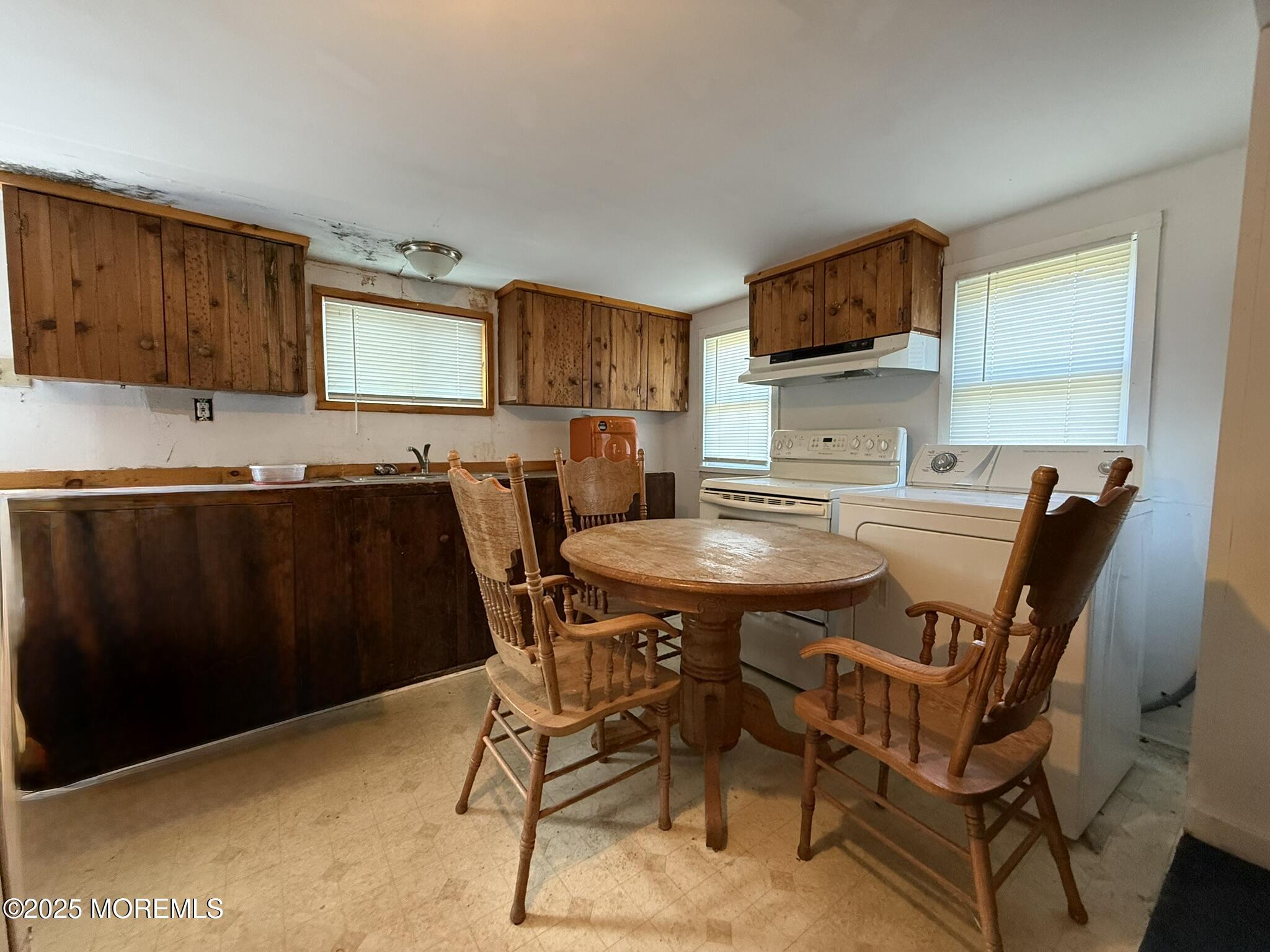 225 Jones Road, Unit 104 Barnegat, NJ 08005 - Photo 5 of 44 a view of a dining room with furniture