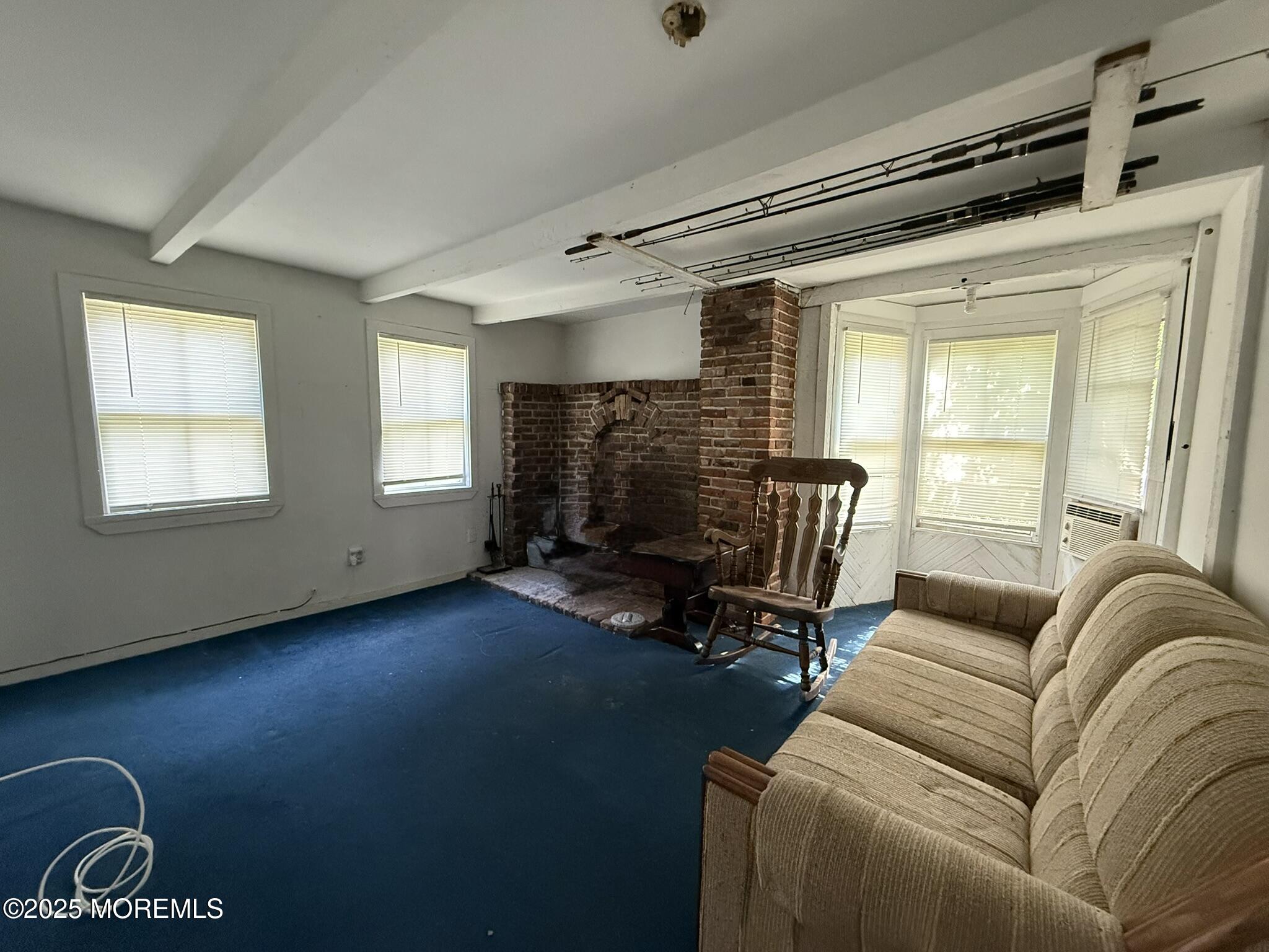 225 Jones Road, Unit 104 Barnegat, NJ 08005 - Photo 8 of 44 a living room with furniture and a window