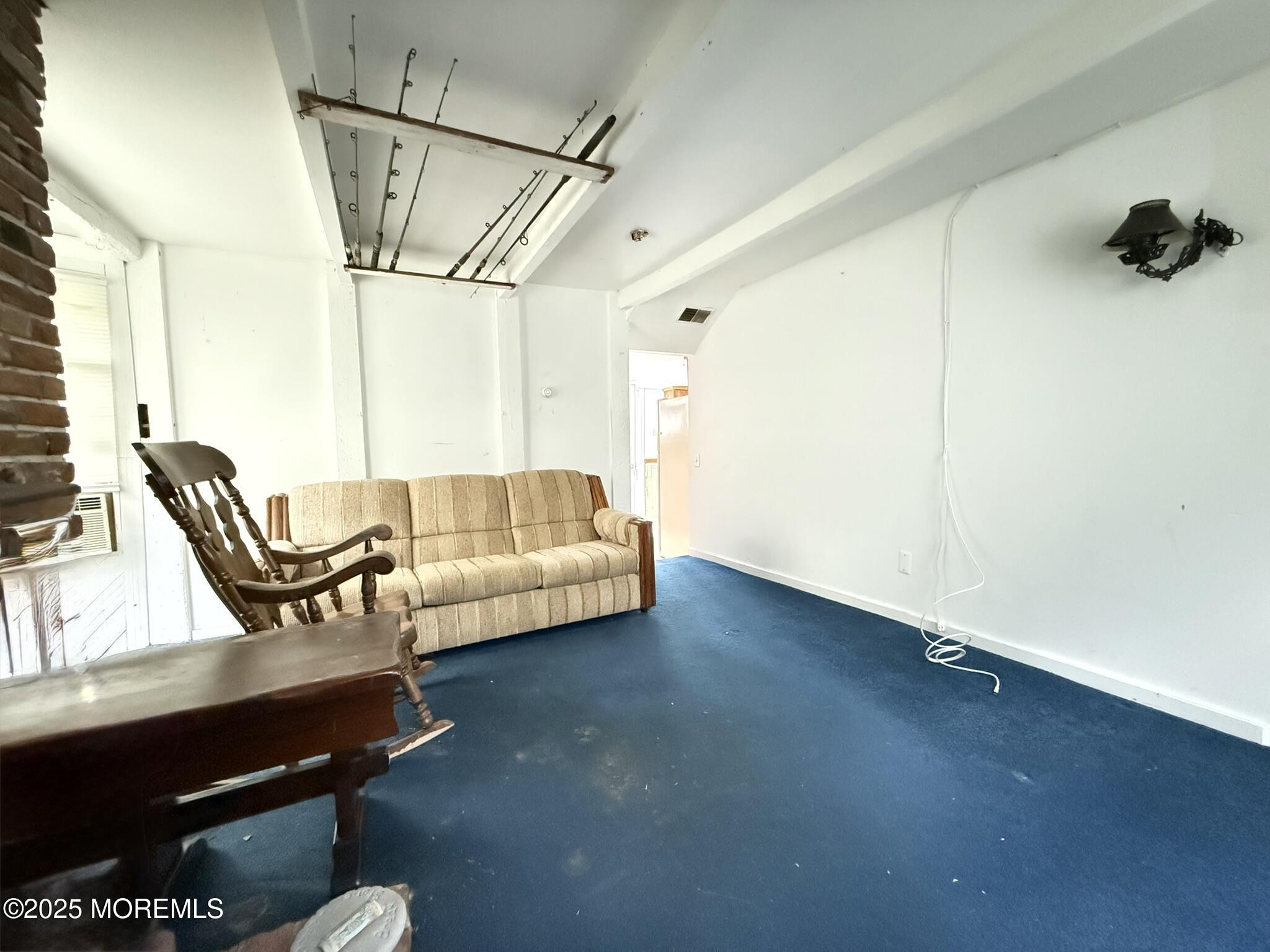 225 Jones Road, Unit 104 Barnegat, NJ 08005 - Photo 9 of 44 a living room with furniture and a window
