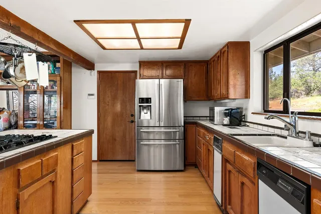 a view of a hallway with wooden shelves