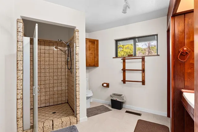 a bed room with a bed and a chair