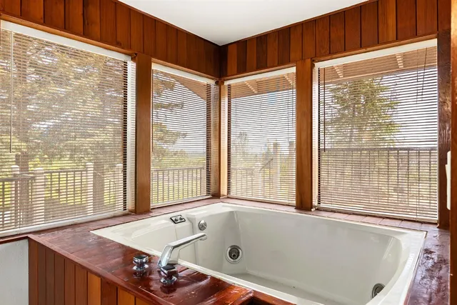 a view of a balcony with wooden floor