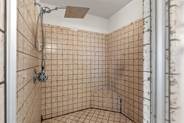 a view of a balcony with wooden floor