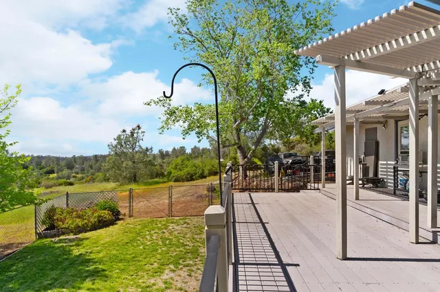 a view of a swimming pool with an outdoor seating