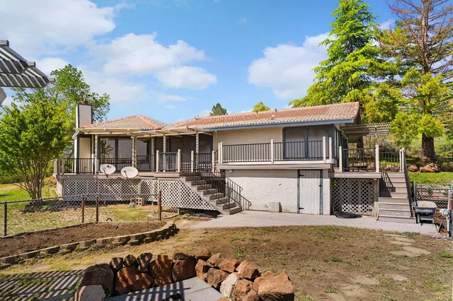 a view of a swimming pool with a patio