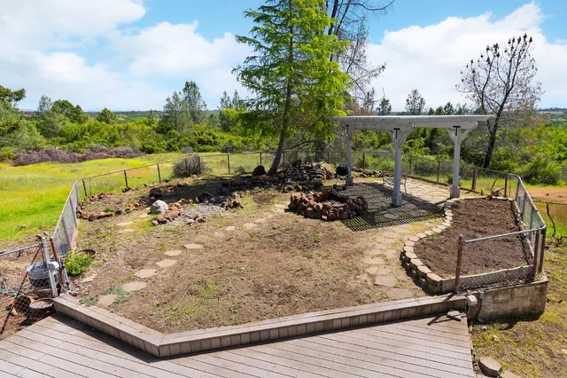 a view of a balcony with table and chairs