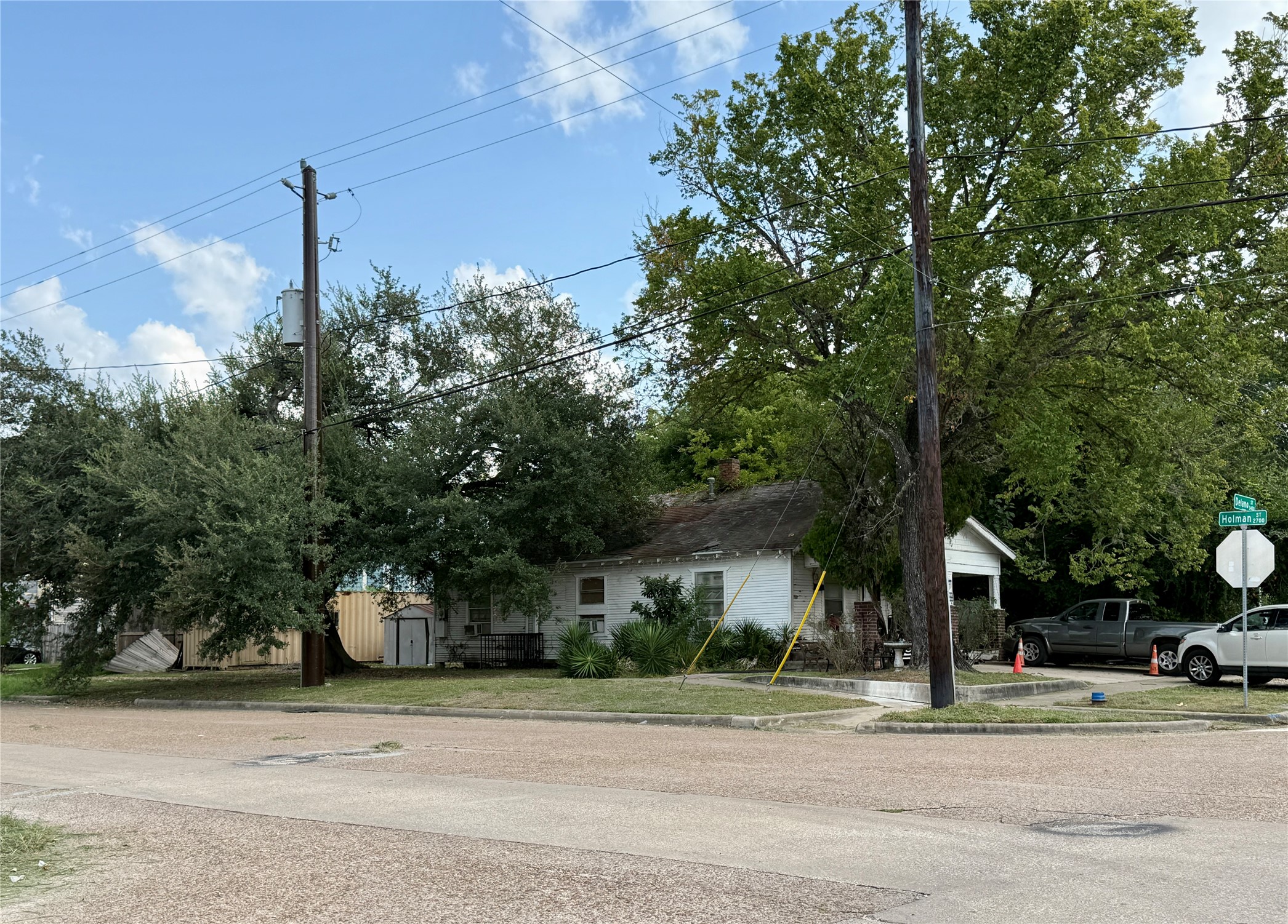 3420 Delano Street Houston, TX 77004 - Photo 1 of 9 a yellow house with trees in front of it