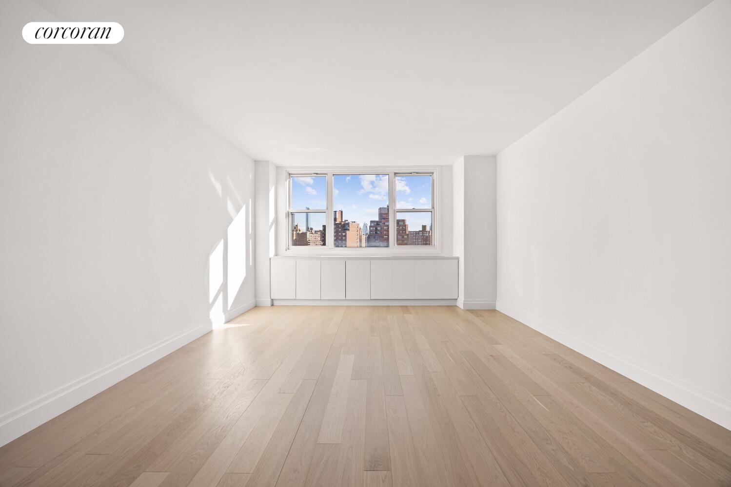 61 Jane Street, Unit 14J Manhattan, NY 10014 - Photo 1 of 8 a view of empty room with wooden floor