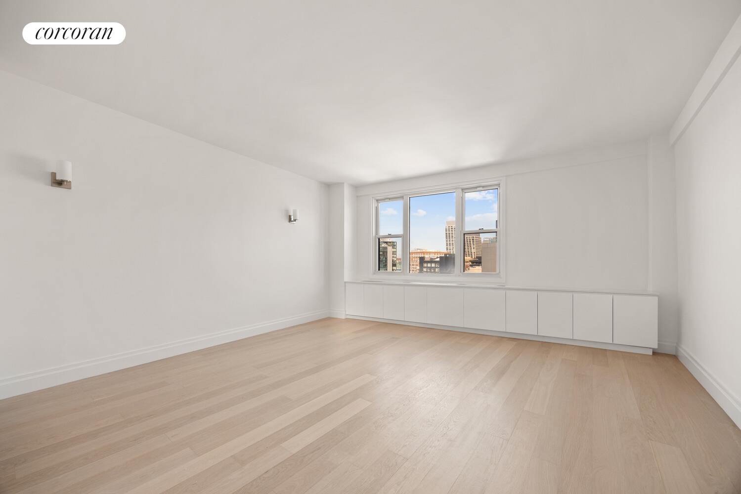 61 Jane Street, Unit 14J Manhattan, NY 10014 - Photo 4 of 8 a view of an empty room with a window