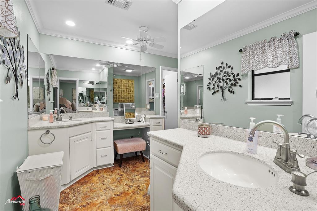 342 Merritt Road Benton, LA 71006 - Photo 17 of 38 a bathroom with double vanity sink a mirror and a shower