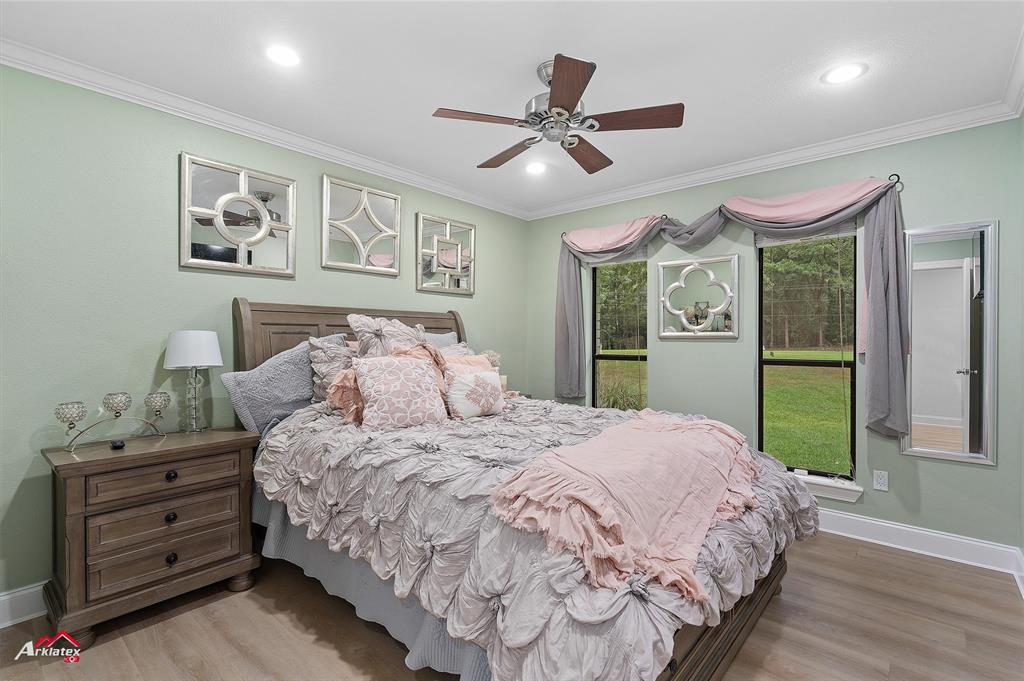 342 Merritt Road Benton, LA 71006 - Photo 19 of 38 a bedroom with a large bed and a window