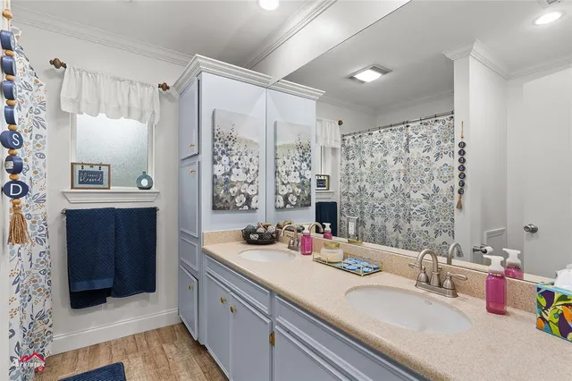 a bathroom with a double vanity sink mirror and double