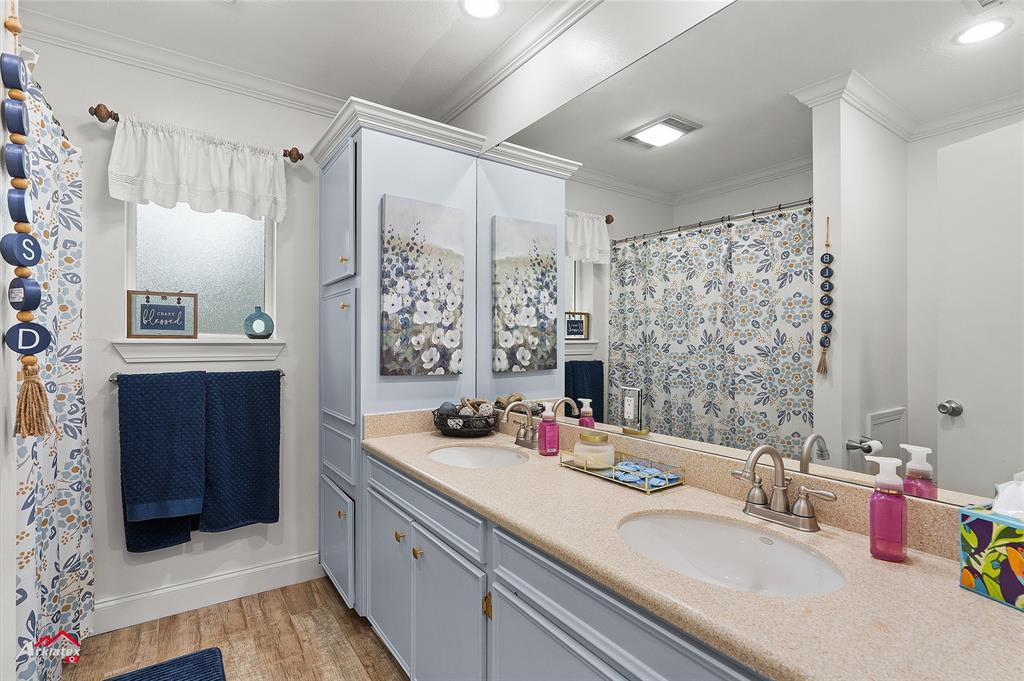342 Merritt Road Benton, LA 71006 - Photo 21 of 38 a bathroom with a double vanity sink mirror and double