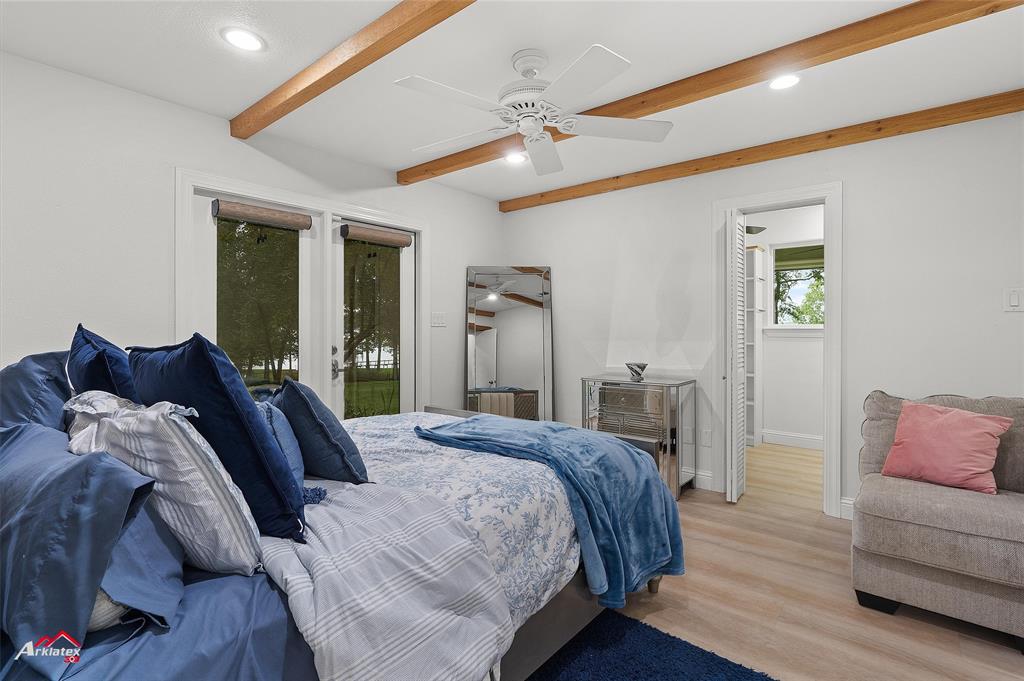 342 Merritt Road Benton, LA 71006 - Photo 22 of 38 a bedroom with a bed and a couch