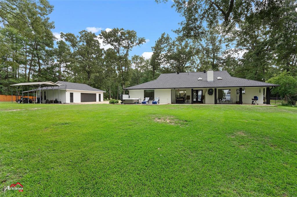 342 Merritt Road Benton, LA 71006 - Photo 25 of 38 a front view of house with yard and green space