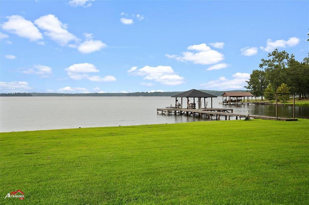 342 Merritt Road Benton, LA 71006 - Photo 30 of 38 a view of a lake with a big yard