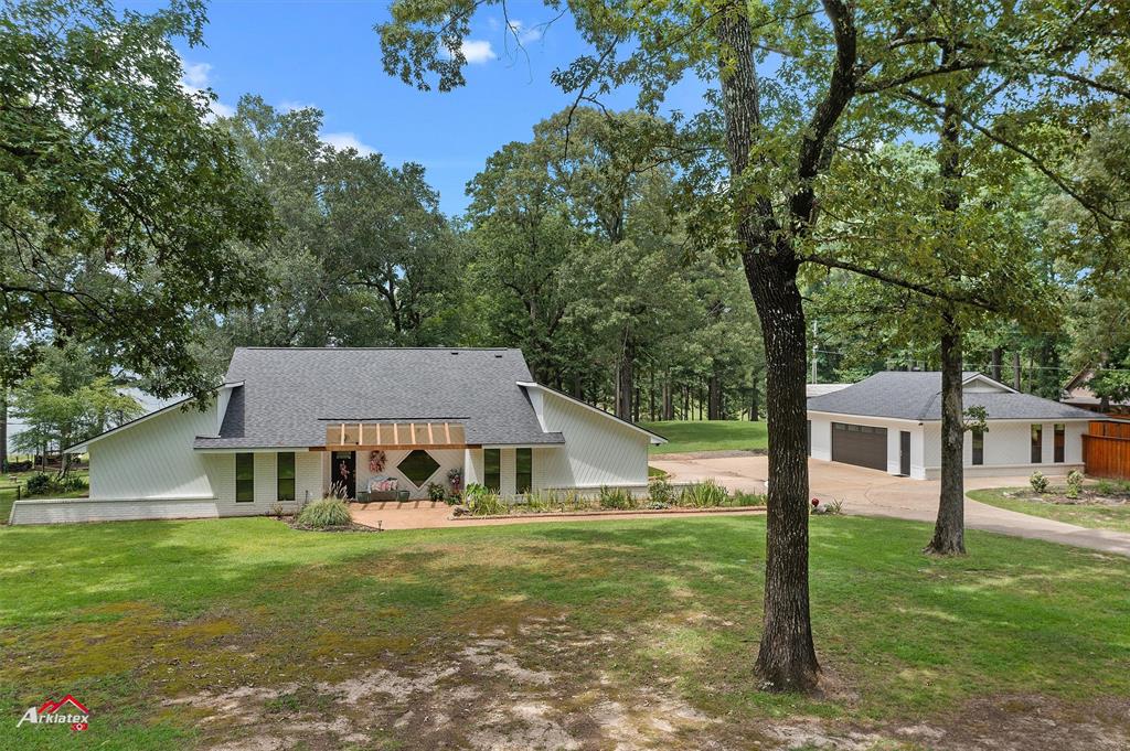 342 Merritt Road Benton, LA 71006 - Photo 36 of 38 a aerial view of a house with swimming pool next to a big yard