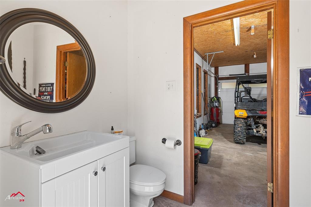 342 Merritt Road Benton, LA 71006 - Photo 37 of 38 a bathroom with a sink and a mirror