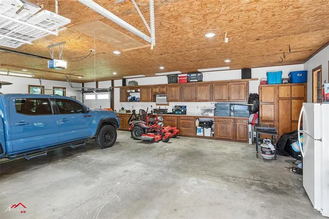 a view of parking garage with cars