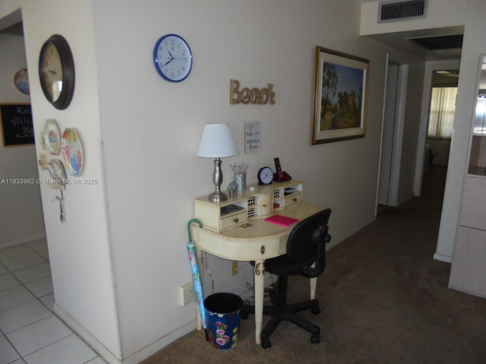 31 Fanshaw A, Unit 31A Boca Raton, FL 33434 - Photo 2 of 12 a dining room with furniture and a mirror