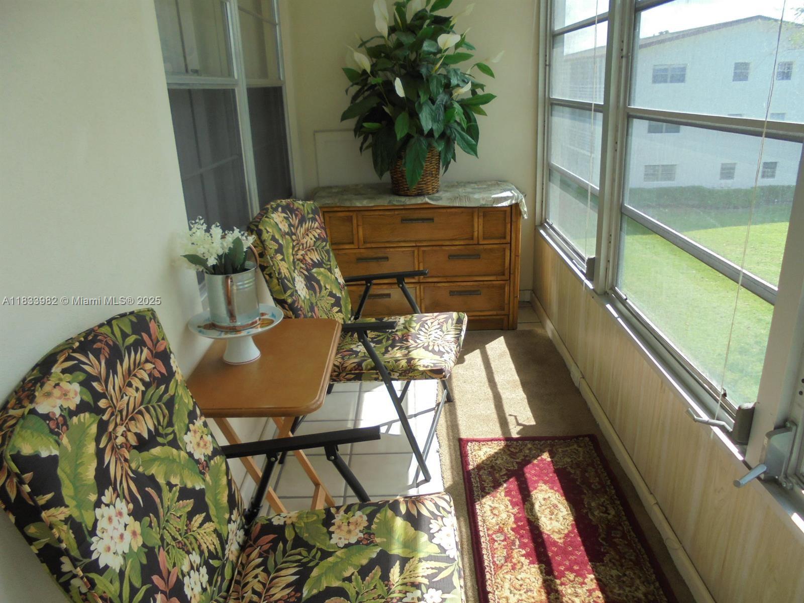 31 Fanshaw A, Unit 31A Boca Raton, FL 33434 - Photo 7 of 12 a vase of flowers sitting on a table