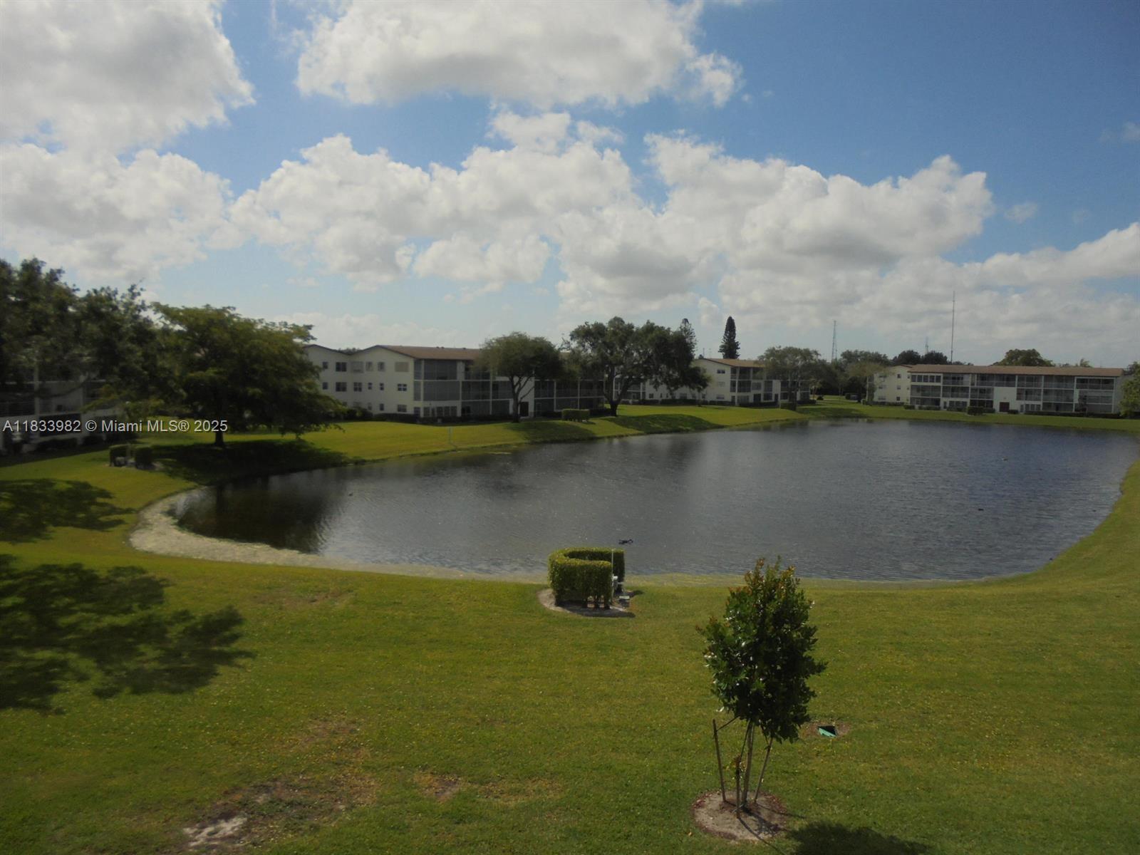 31 Fanshaw A, Unit 31A Boca Raton, FL 33434 - Photo 8 of 12 a view of a lake with a city view