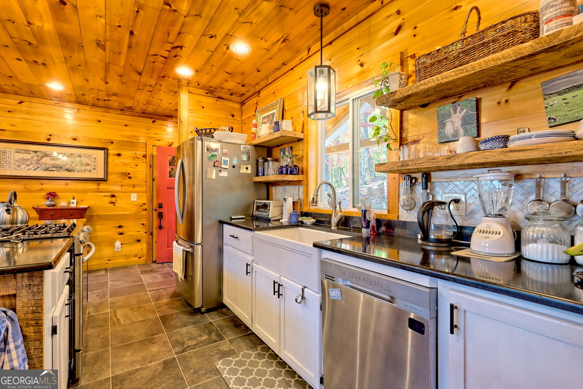 557 Walnut Grove Lane Tiger, GA 30576 - Photo 13 of 75 a kitchen with stainless steel appliances a sink and cabinets