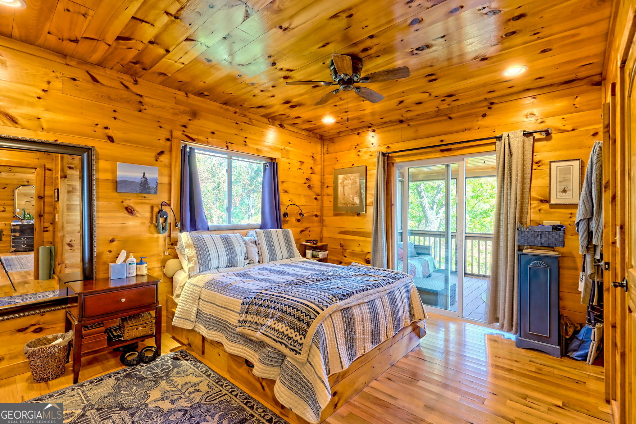 557 Walnut Grove Lane Tiger, GA 30576 - Photo 17 of 75 a bedroom with a bed and wooden floor